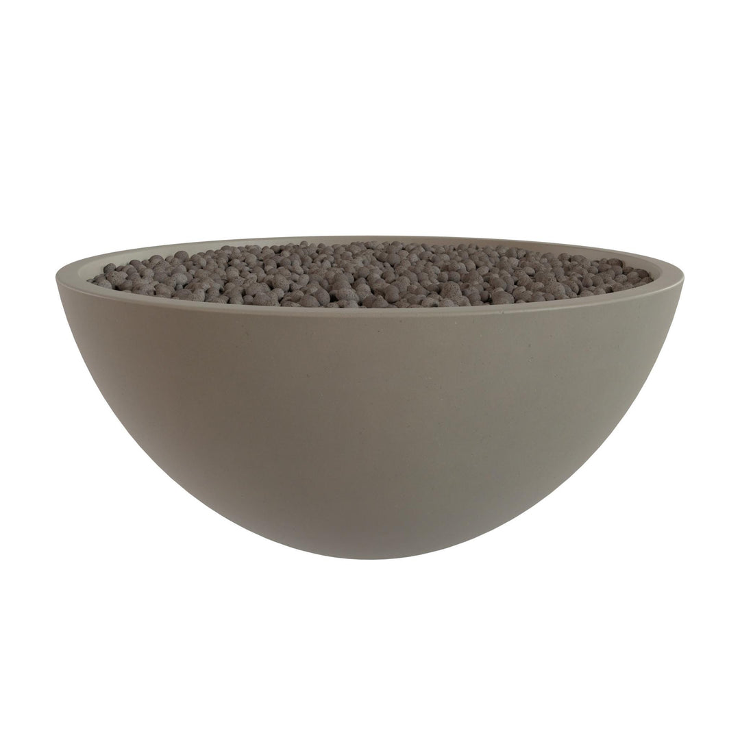 A large, round bowl filled with small, dark-colored stones or pebbles.