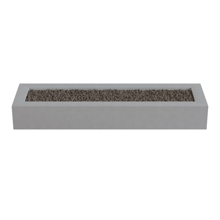 A rectangular concrete planter filled with small rocks or pebbles.
