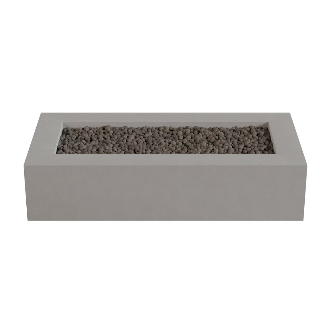A rectangular concrete planter filled with small rocks or pebbles.