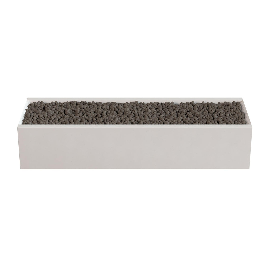 A rectangular planter box filled with small rocks or pebbles.
