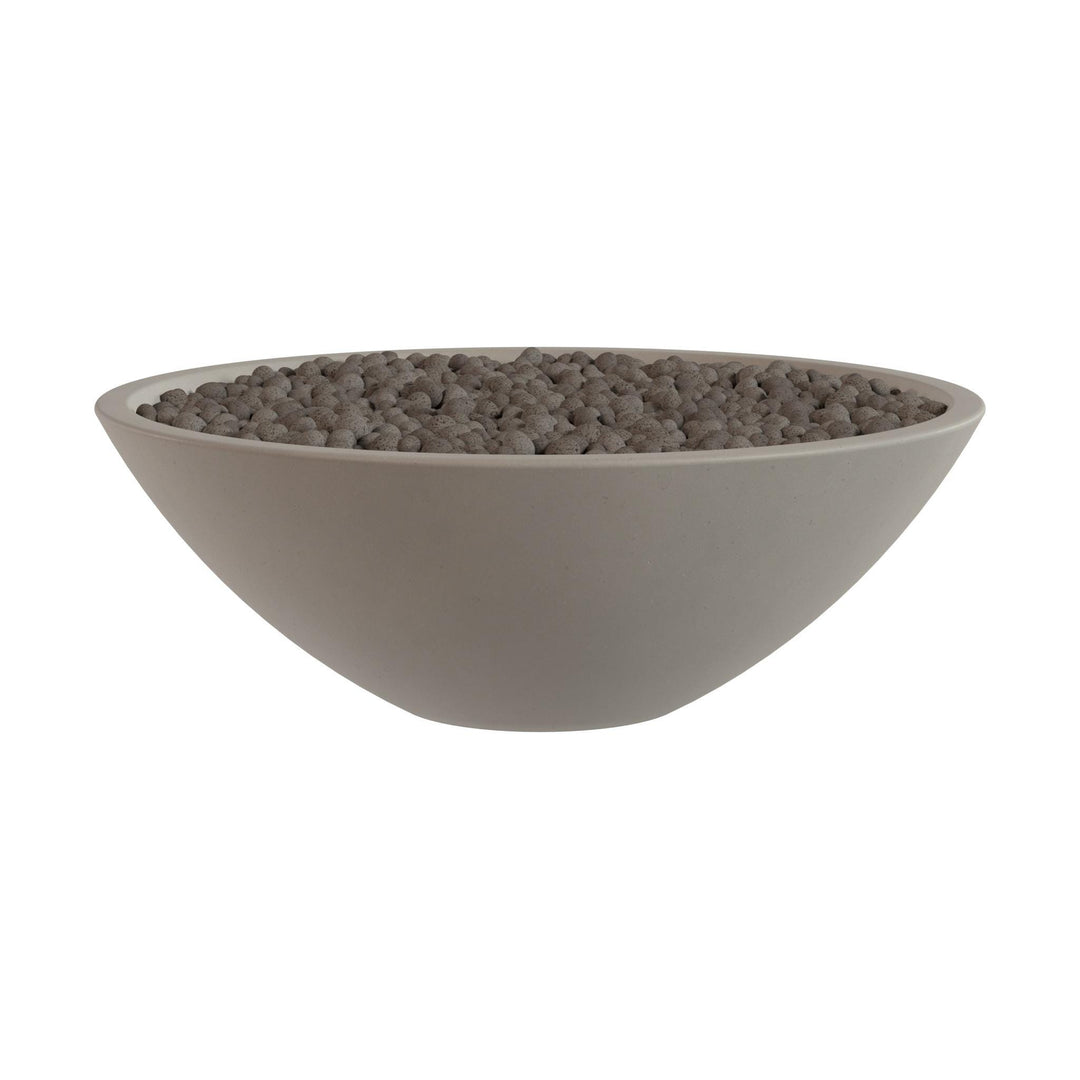 A large, round bowl filled with small, dark-colored stones or pebbles.