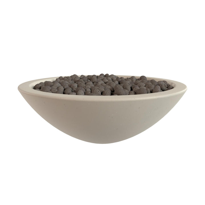 A white bowl filled with small, dark-colored objects, possibly stones or pebbles.