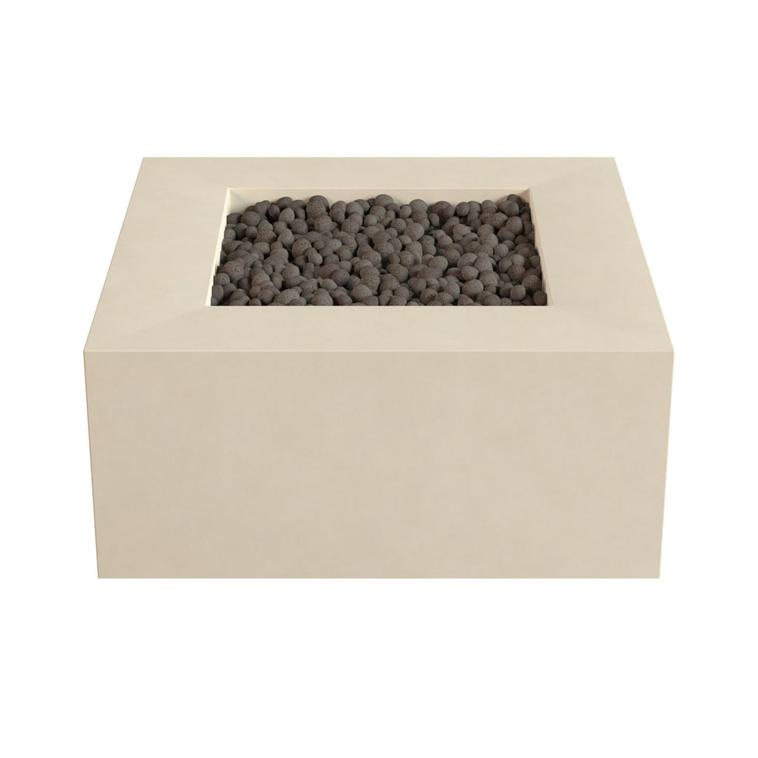 A rectangular beige-colored structure with a small opening at the top, filled with small black stones or pebbles.