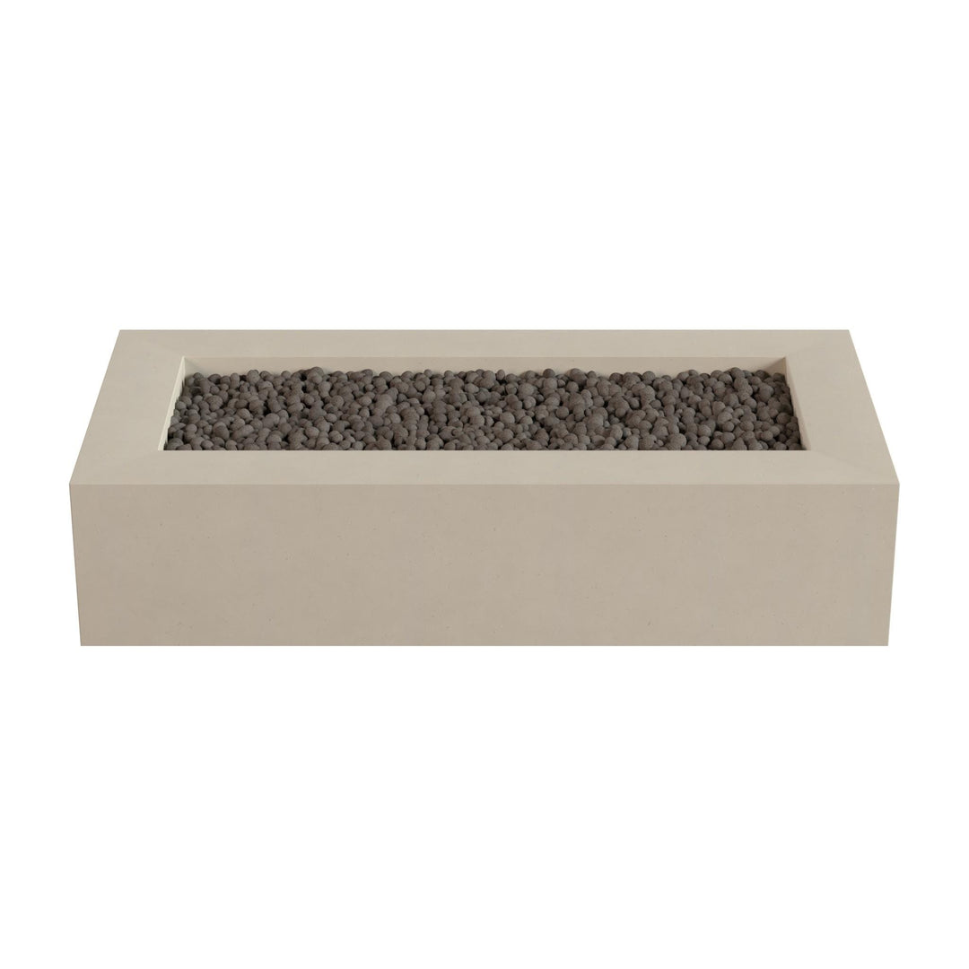 A rectangular concrete planter filled with small gray stones or pebbles.