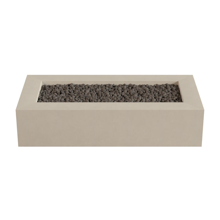 A rectangular concrete planter filled with small gray stones or pebbles.