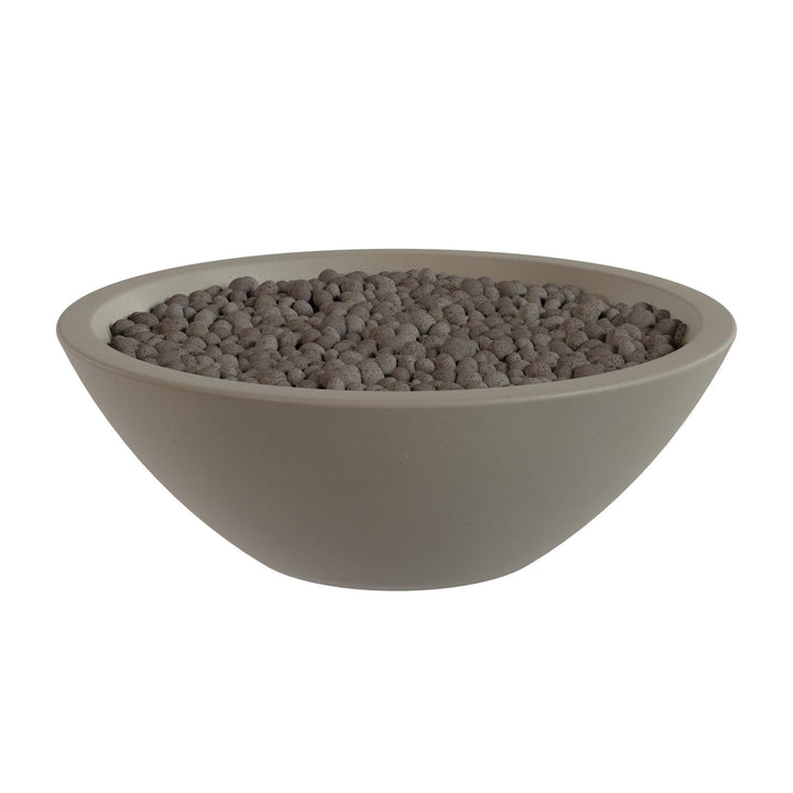 A large, round bowl filled with small, dark-colored stones or pebbles.