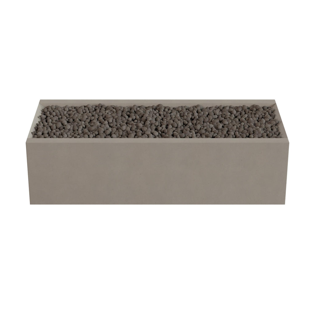 A rectangular planter box filled with small rocks or pebbles.