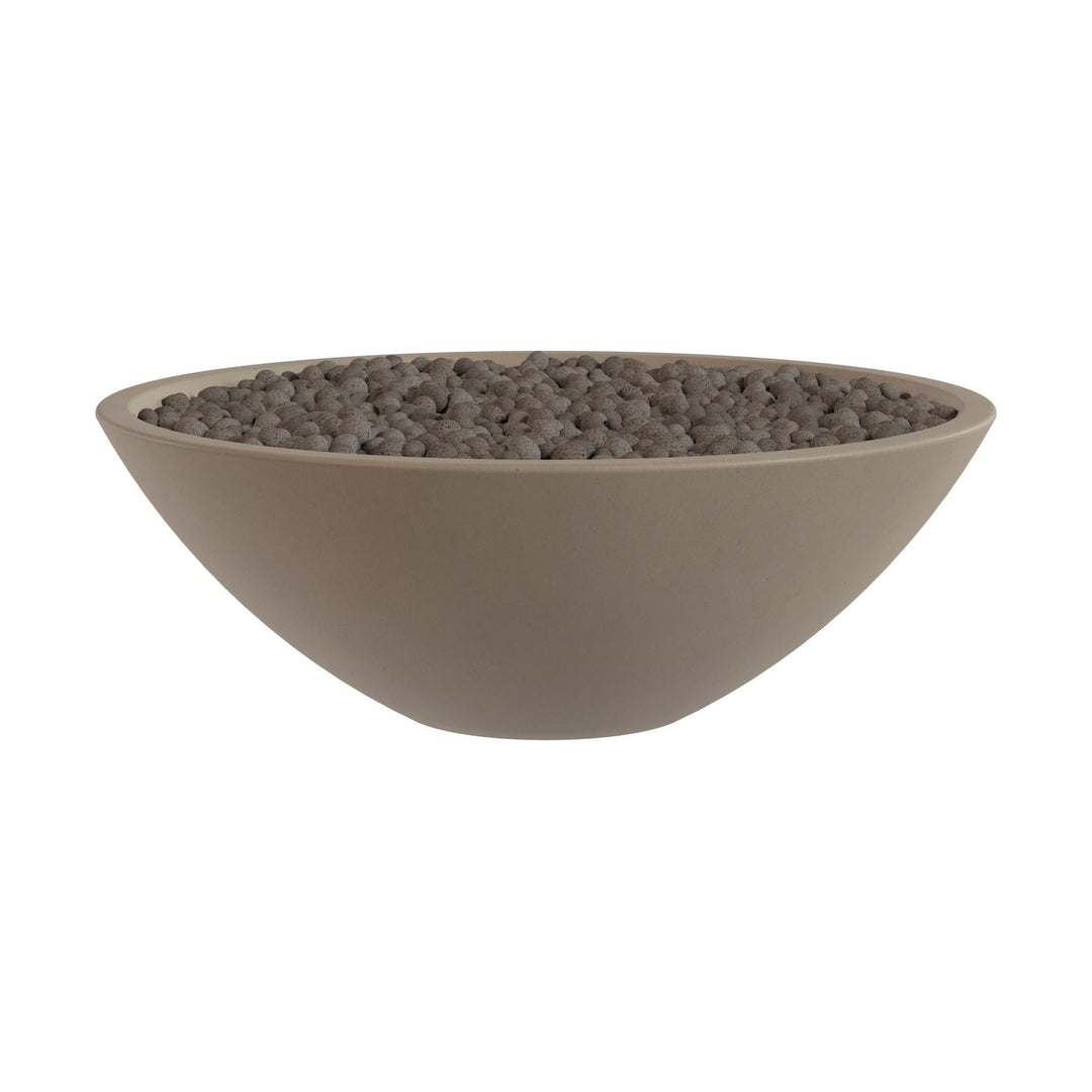 A large, round bowl filled with small, dark-colored stones or pebbles.