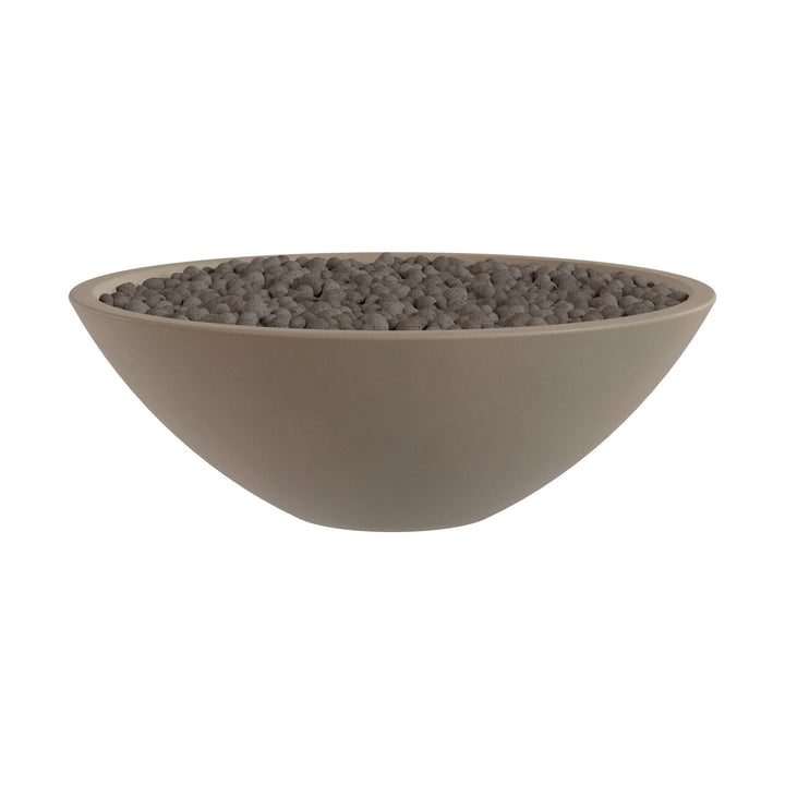 A large, round bowl filled with small, dark-colored stones or pebbles.