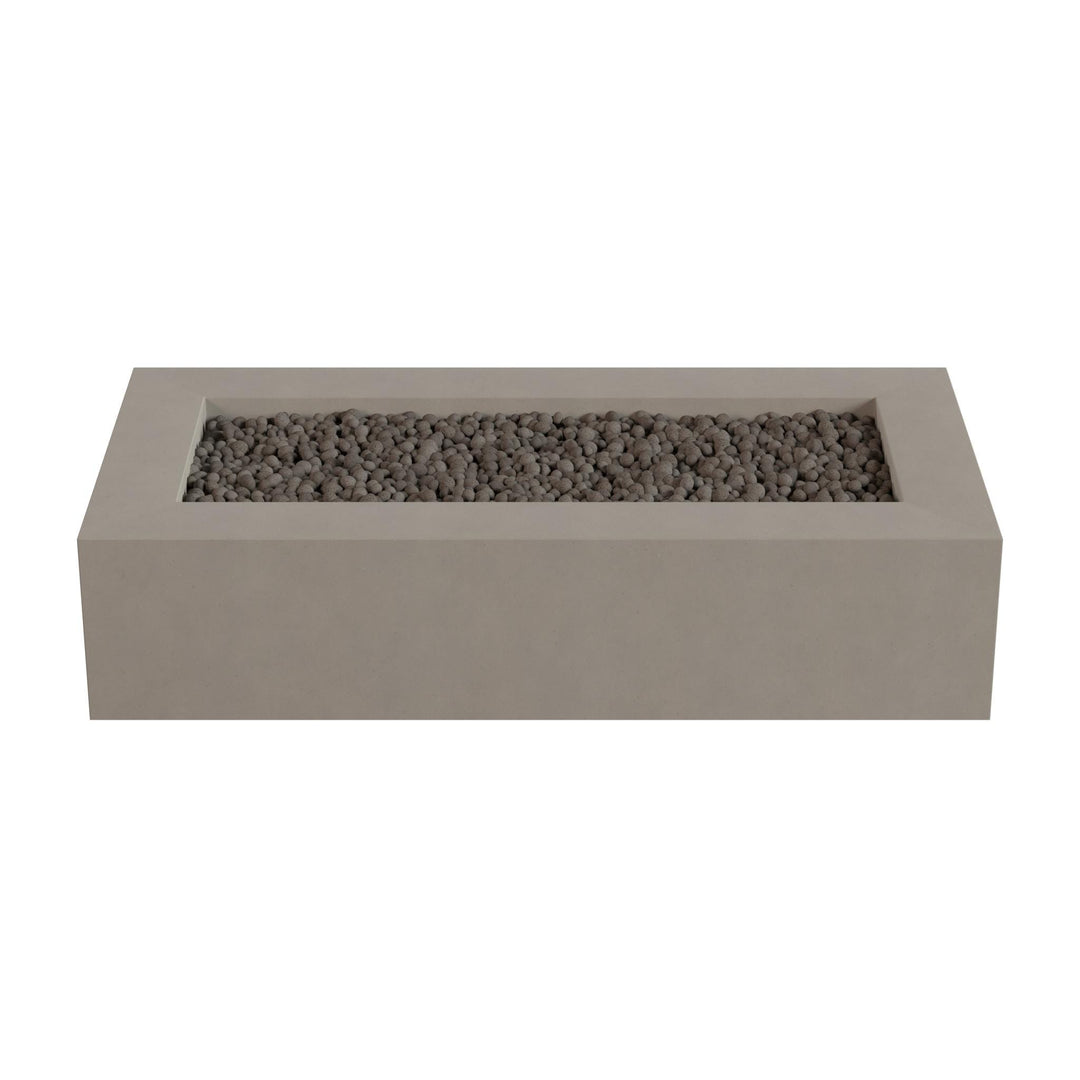 A rectangular concrete planter filled with small rocks or pebbles.