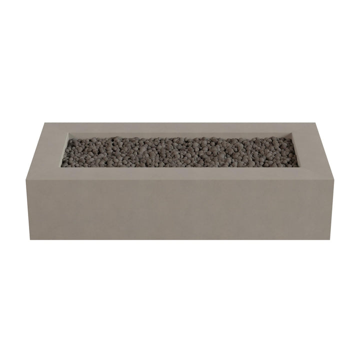 A rectangular concrete planter filled with small rocks or pebbles.