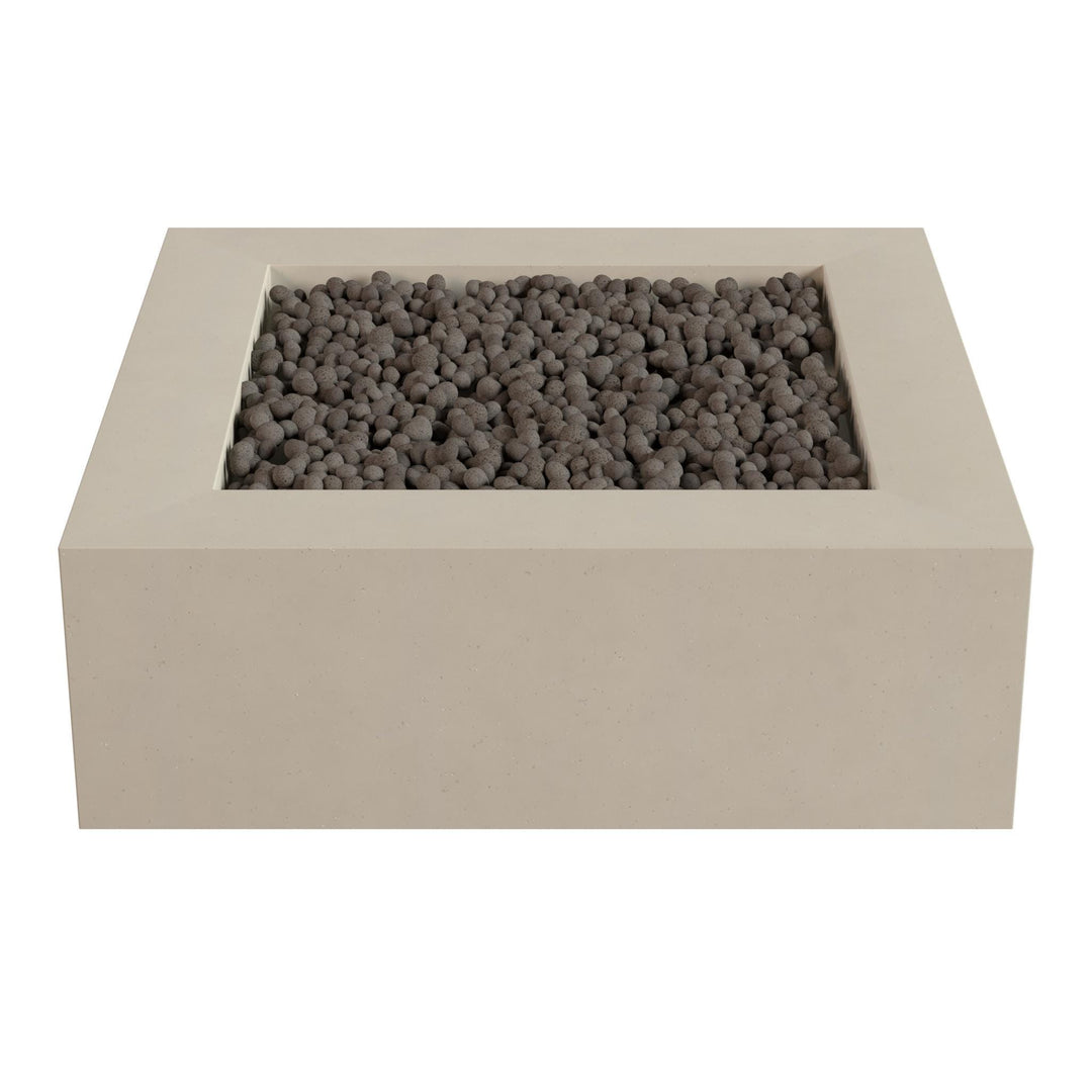 a rectangular, beige-colored structure with a small opening at the top, filled with small, dark-colored stones or pebbles.