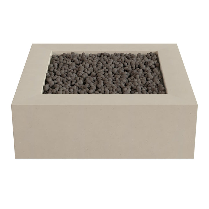 a rectangular, beige-colored structure with a small opening at the top, filled with small, dark-colored stones or pebbles.