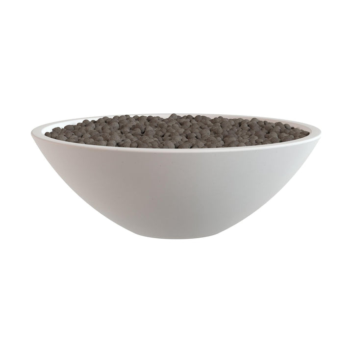 A white bowl filled with dark brown pebbles or stones.