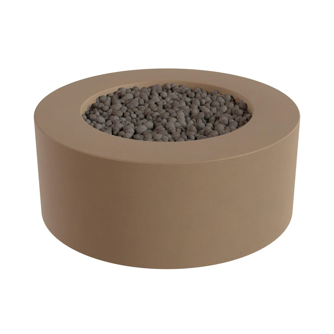a round, beige-colored fire pit or planter filled with small gray stones or pebbles.
