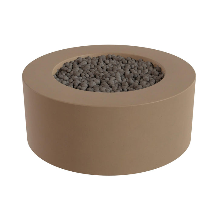 a round, beige-colored fire pit or planter filled with small gray stones or pebbles.