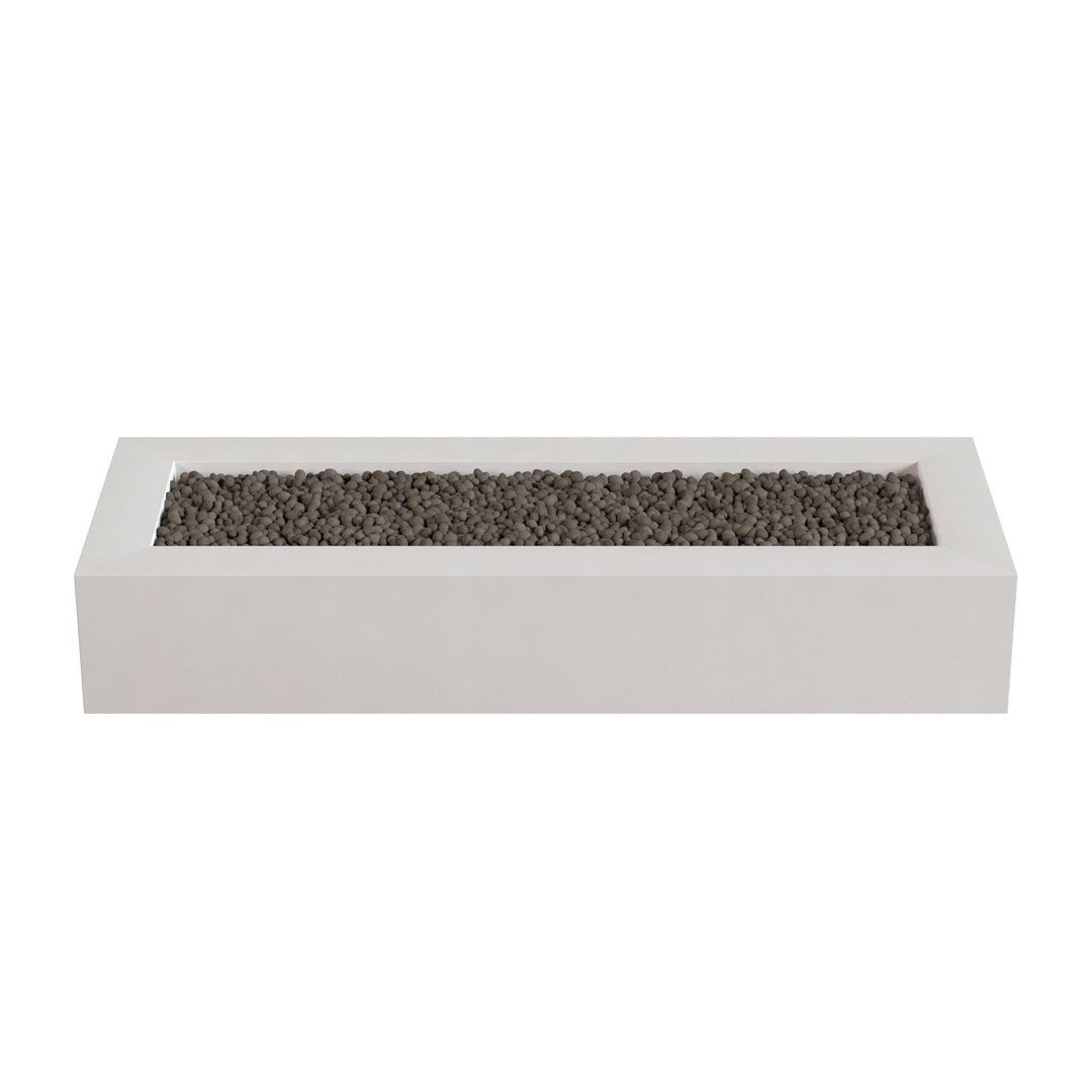 A rectangular white planter box filled with small dark rocks or pebbles.