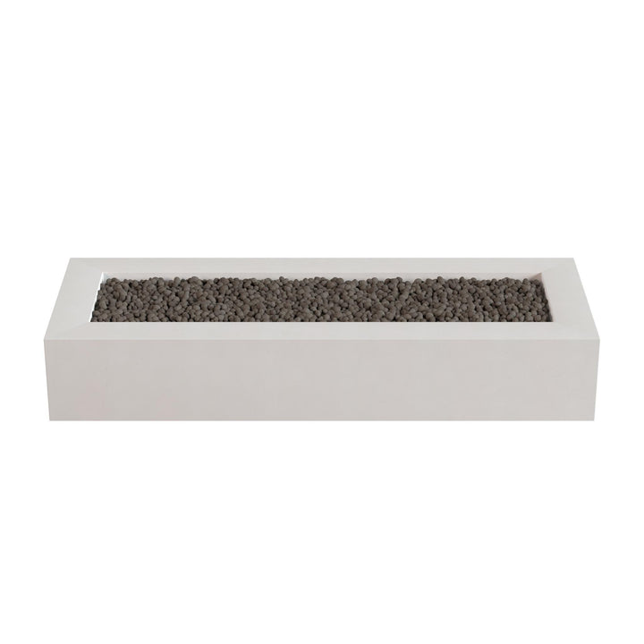 A rectangular white planter box filled with small dark rocks or pebbles.