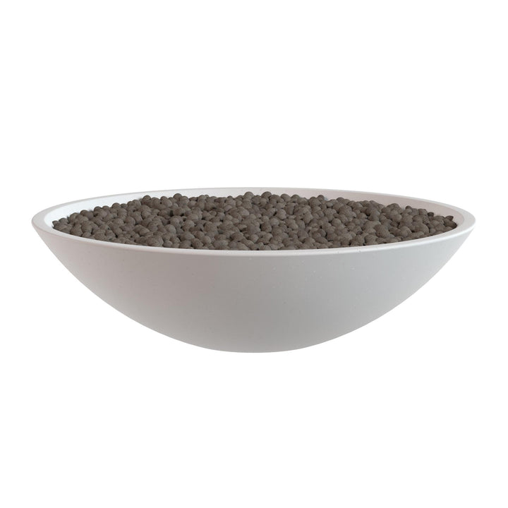 A white bowl filled with dark brown grains or seeds, such as coffee beans or cocoa beans, is shown against a white background.