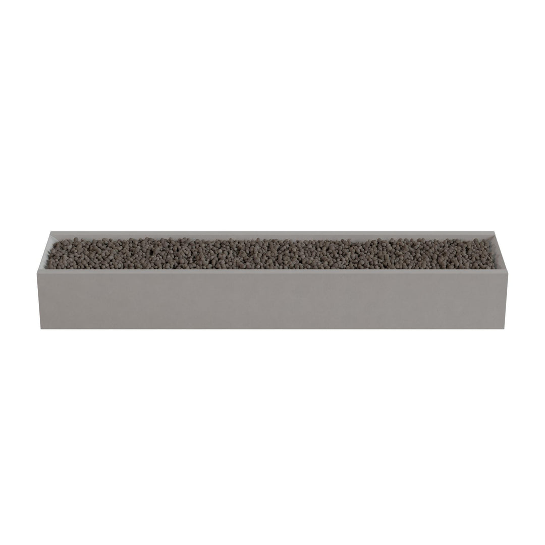 A rectangular planter box filled with small rocks or pebbles.