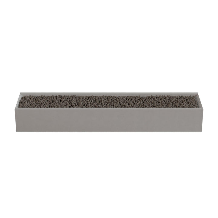 A rectangular planter box filled with small rocks or pebbles.