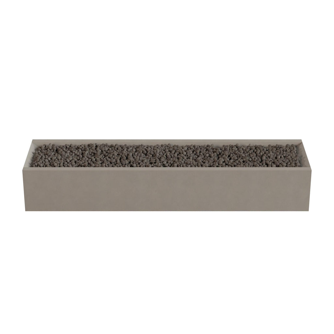 A rectangular planter box filled with small rocks or pebbles.