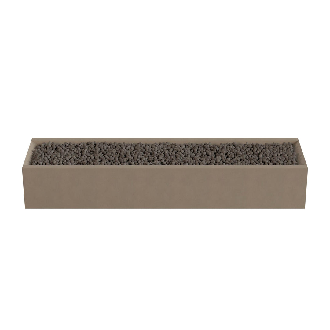 A rectangular planter box filled with small rocks or pebbles.