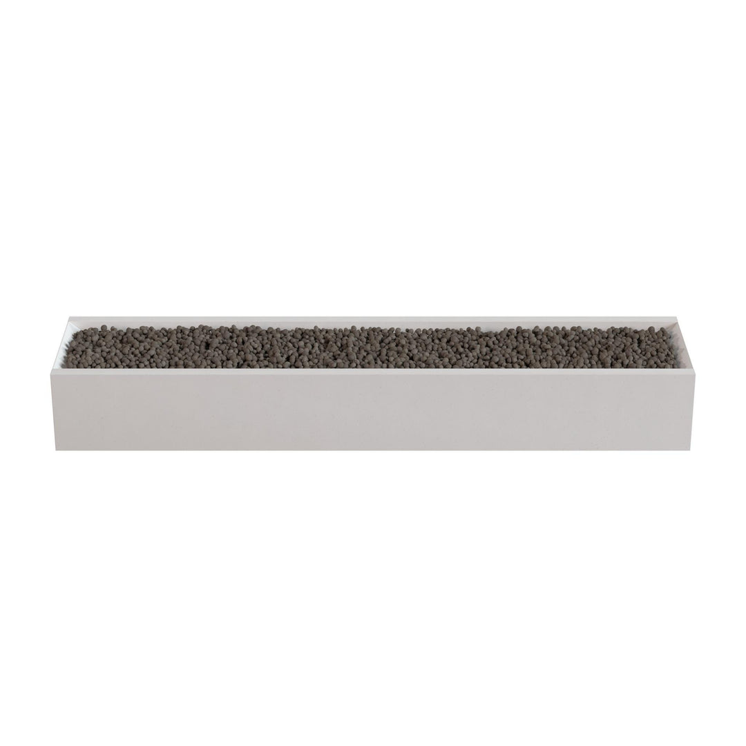 A rectangular planter box filled with small rocks or pebbles.