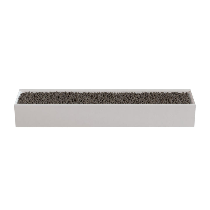 A rectangular planter box filled with small rocks or pebbles.