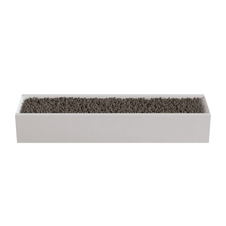 A rectangular white planter box filled with small dark-colored stones or pebbles.
