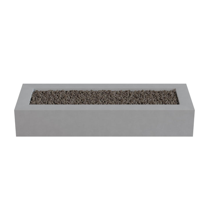 A rectangular concrete planter filled with small rocks or pebbles.