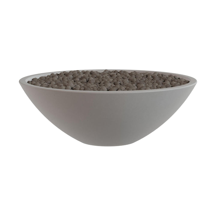 A white bowl filled with small, round objects, possibly beads or grains, is shown against a white background.