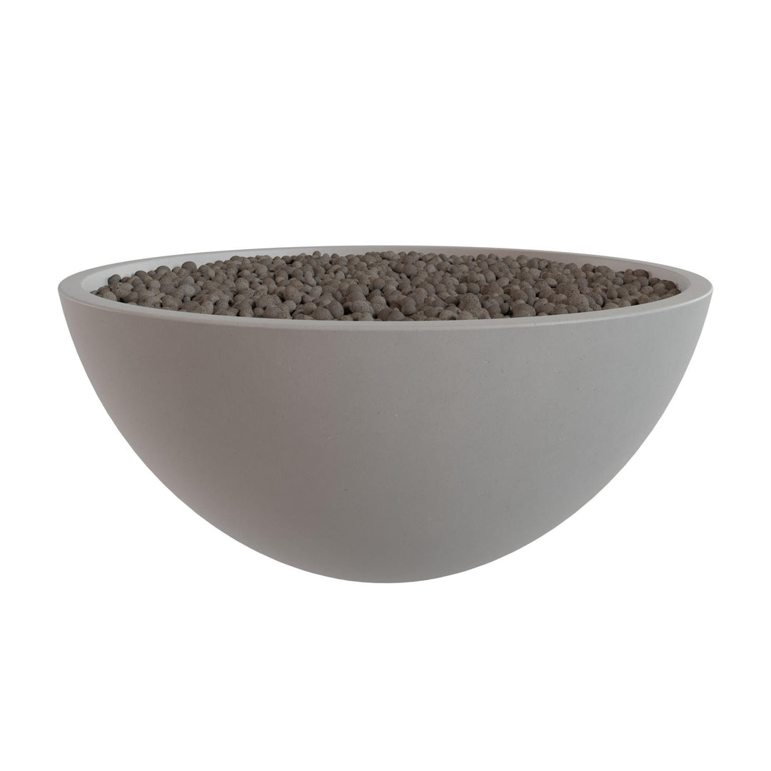 A white bowl filled with small gray stones or pebbles.