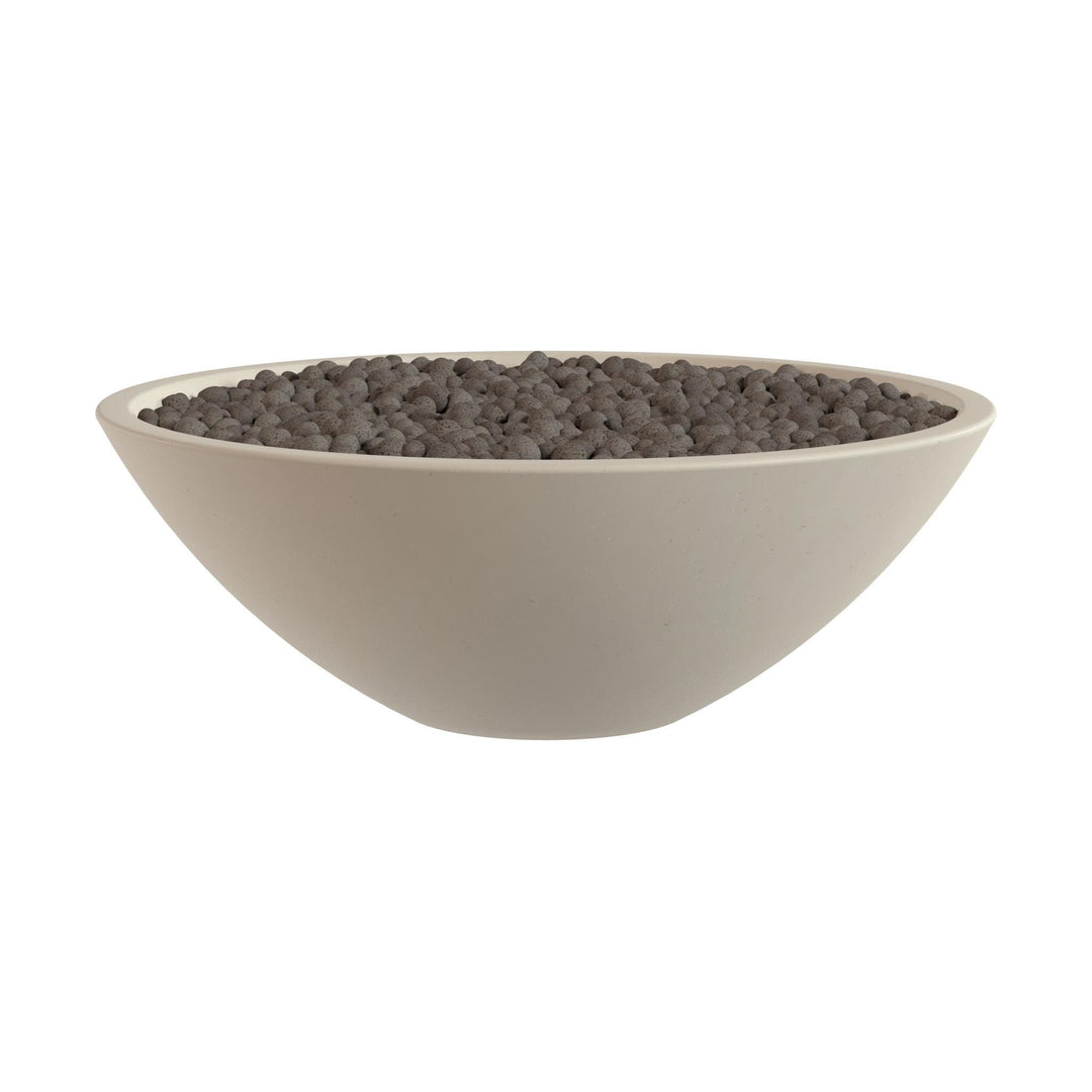 A white bowl filled with small, dark-colored objects, possibly gravel or pebbles.