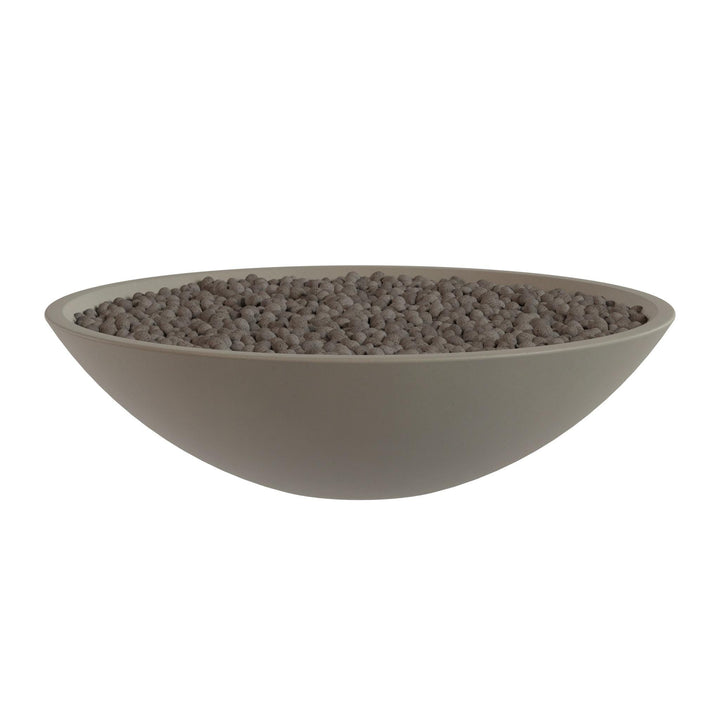 A large, round bowl filled with small, dark-colored stones or pebbles.
