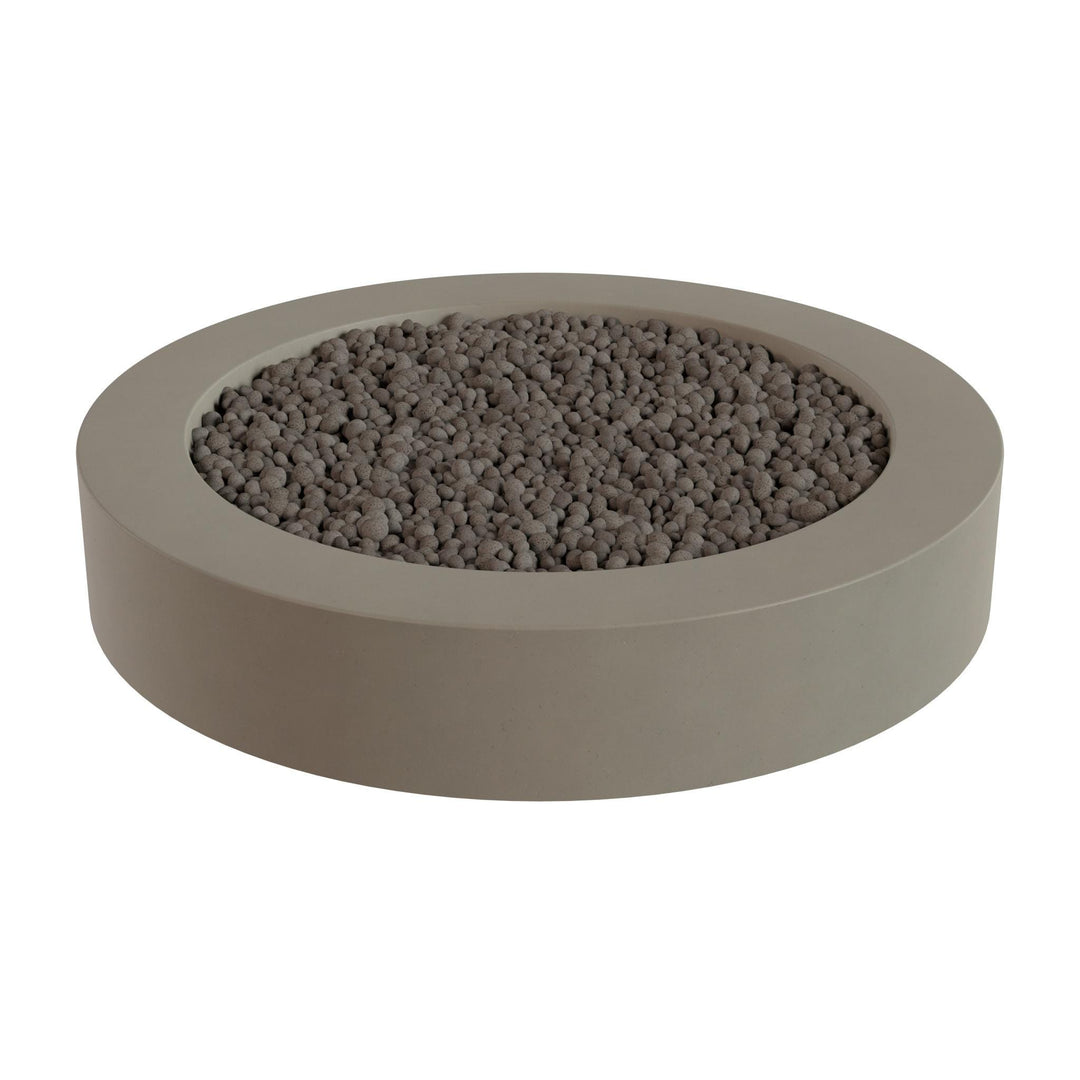 a round, gray planter filled with small rocks or pebbles.