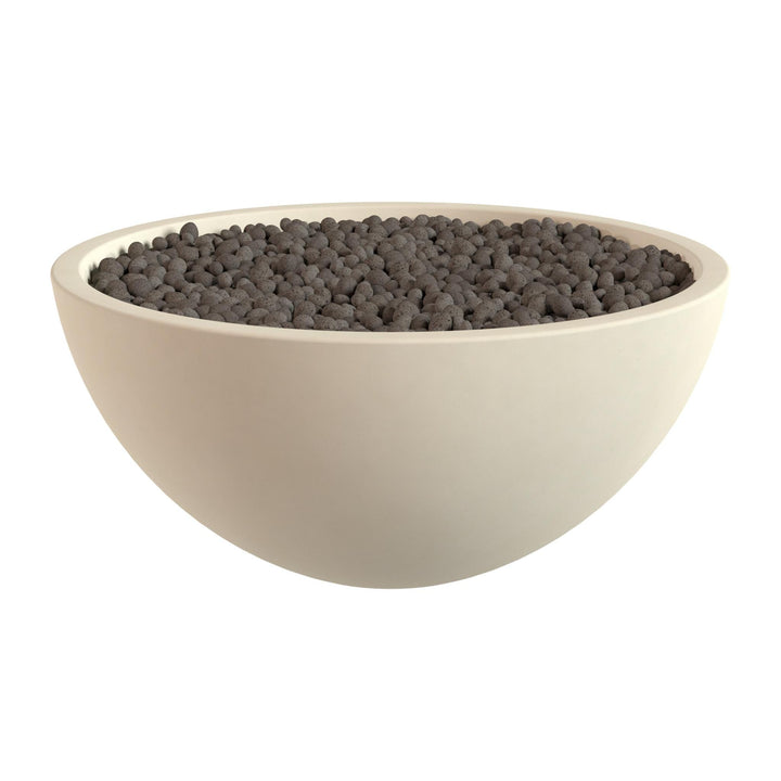 A white bowl filled with dark-colored stones or pebbles.