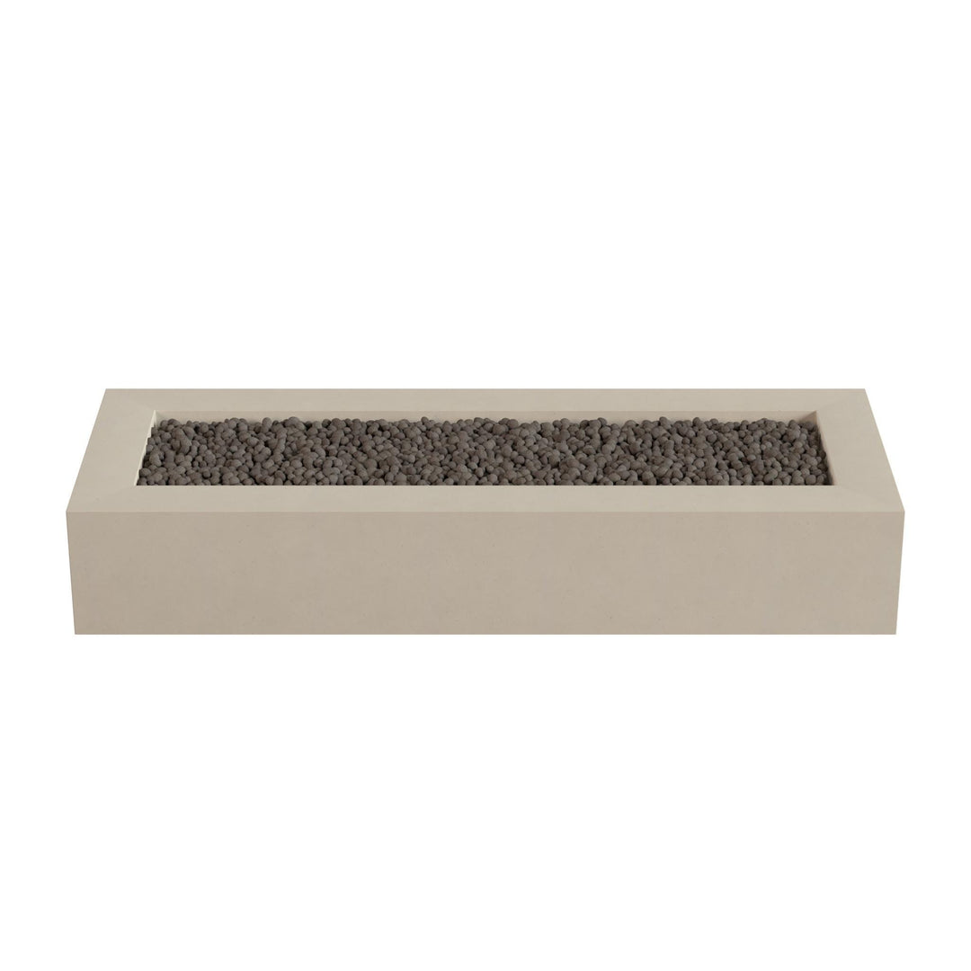 A rectangular concrete planter filled with small rocks or pebbles.