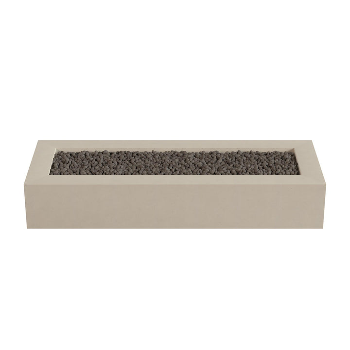A rectangular concrete planter filled with small rocks or pebbles.