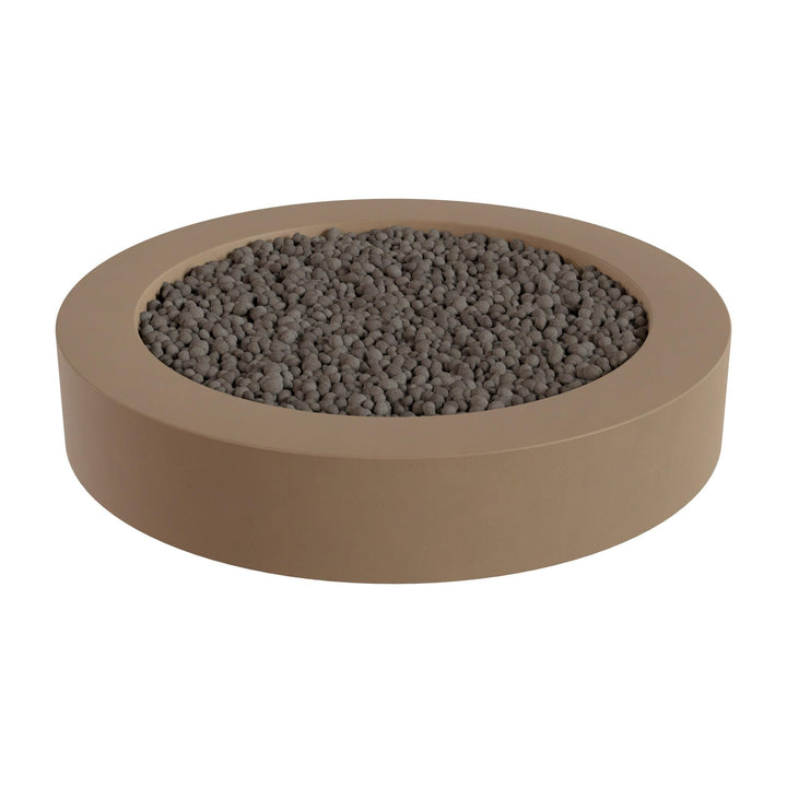 a round, beige-colored container filled with small, dark-colored stones or pebbles.