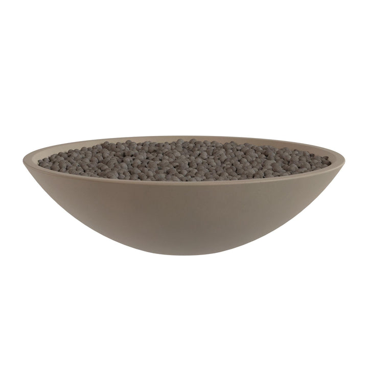 A large, round bowl filled with small, dark-colored stones or pebbles.