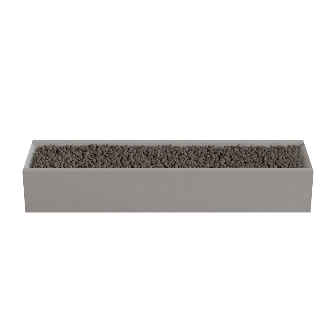 A rectangular planter box filled with small rocks or pebbles.