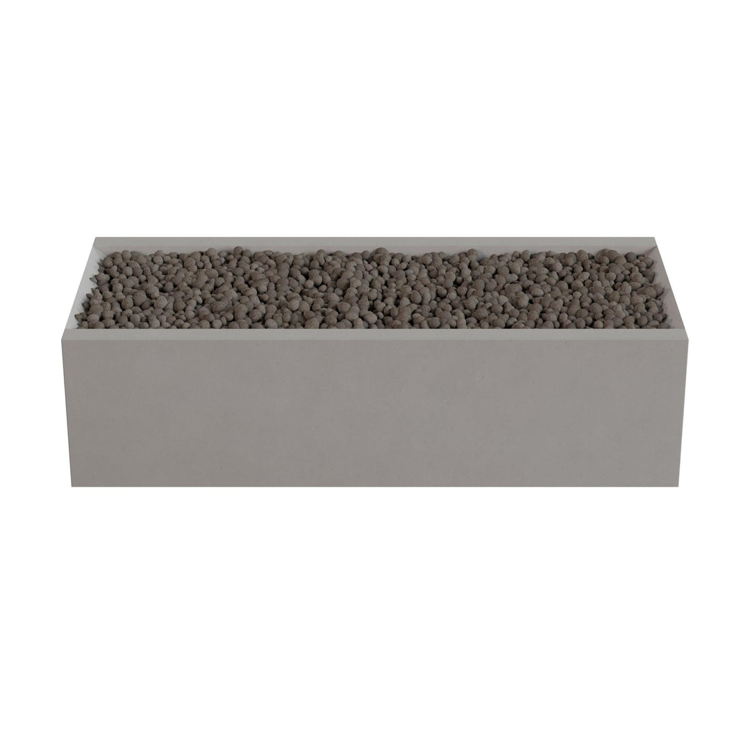A rectangular planter box filled with small rocks or pebbles.