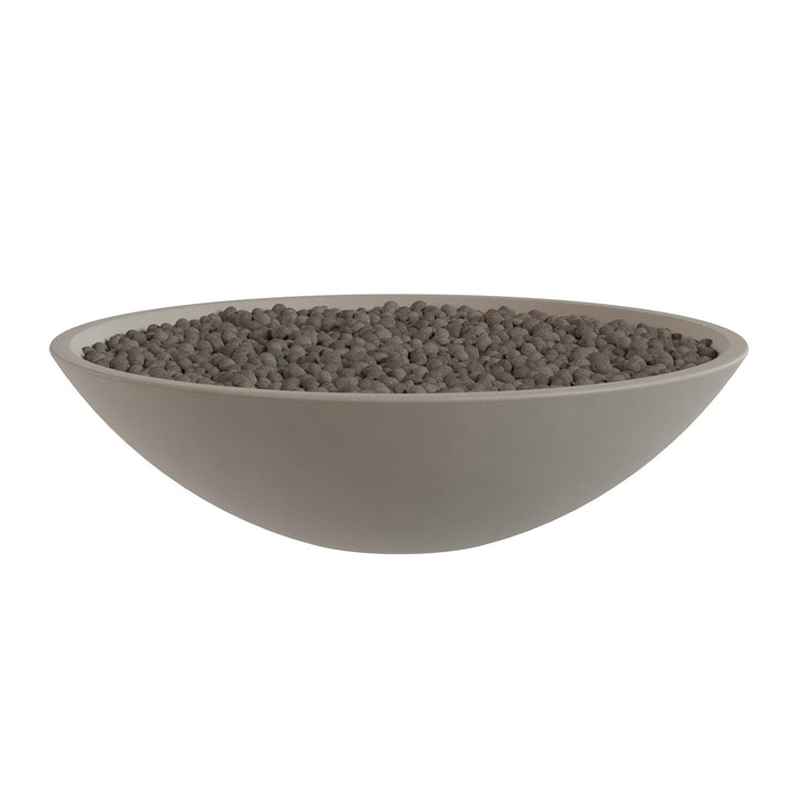 A large, round bowl filled with small, dark-colored stones or pebbles.